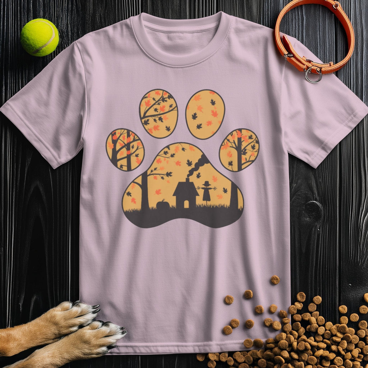 Light pink Paw Print Dog T-Shirt with a fall forest scene inside a paw print. Soft, ethically made cotton shirt by Harvest Woods.