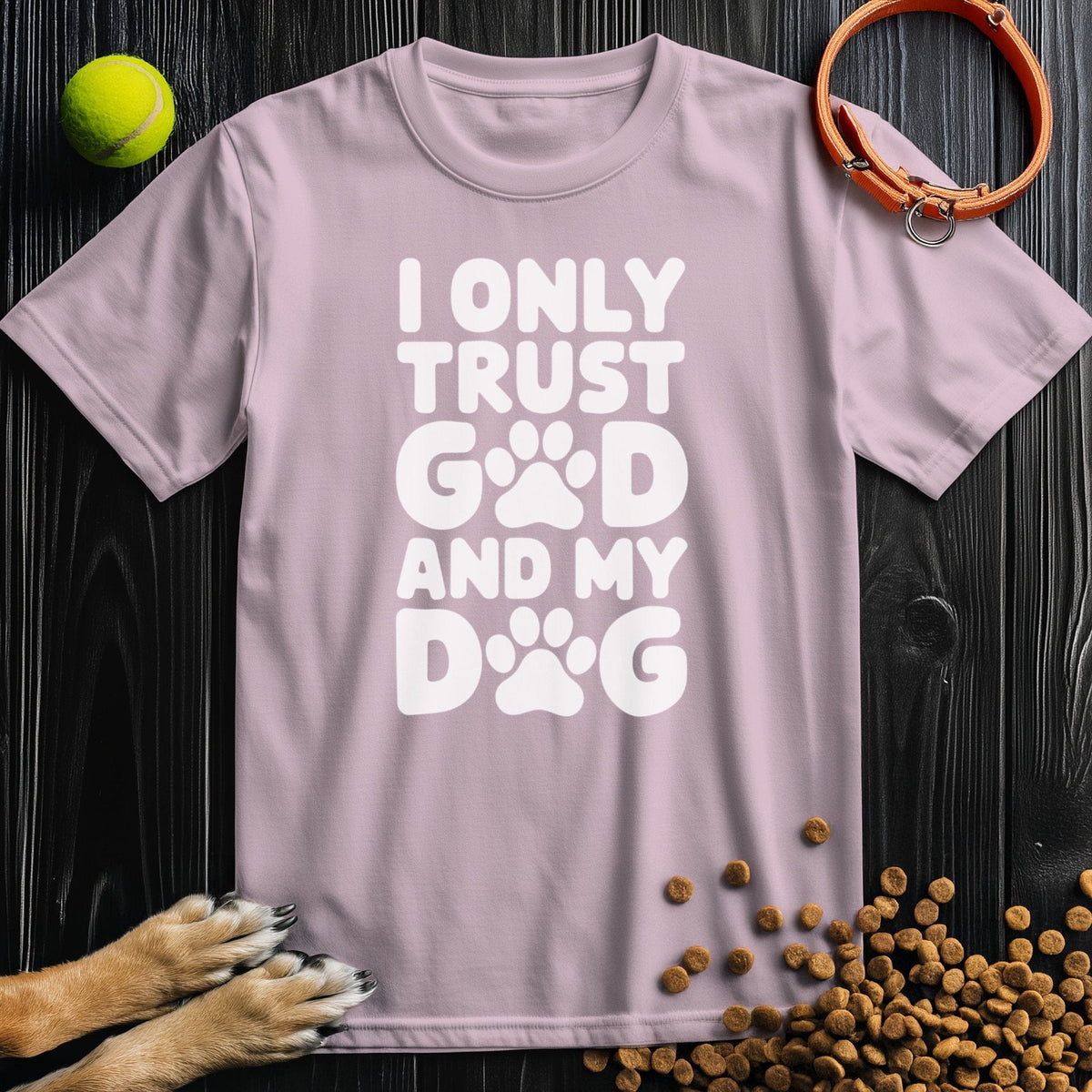 Light pink Dog and God T-Shirt with bold white slogan and paw prints, soft cotton material, ideal for stylish dog enthusiasts.