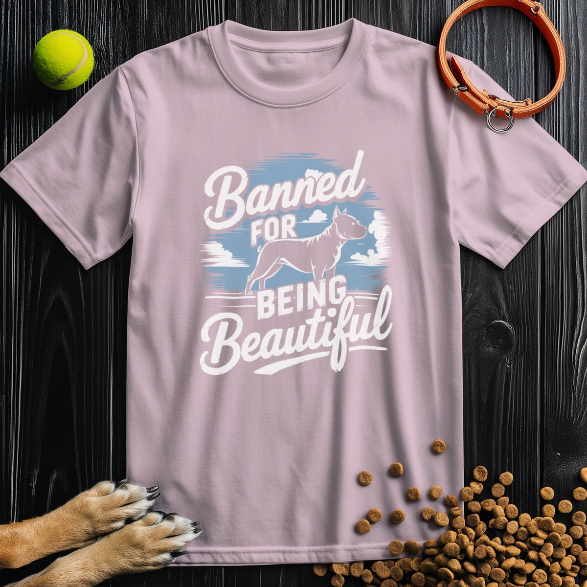 Light pink Banned for Beauty Dog Tee featuring pitbull design and soft cotton. A fashionable and ethical pick for pitbull fans.