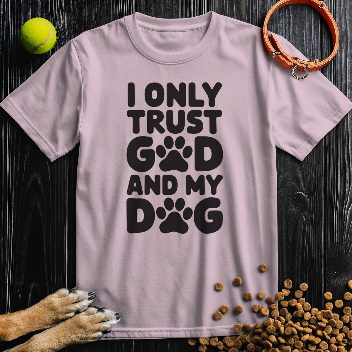 Light pink unisex cotton tee with black 'I Only Trust God and My Dog' text and paw prints. Stylish and ethical dog and god shirt for pet lovers.