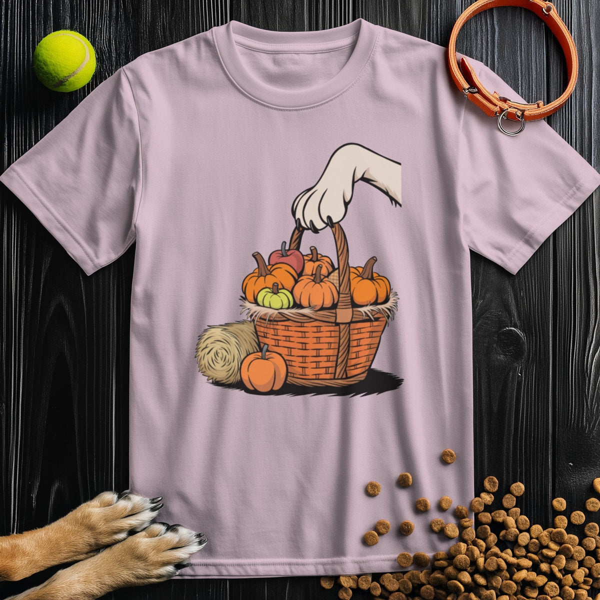 Light pink T-shirt with dog paw and pumpkin basket illustration. Stylish and cozy cotton tee for dog lovers in fall.