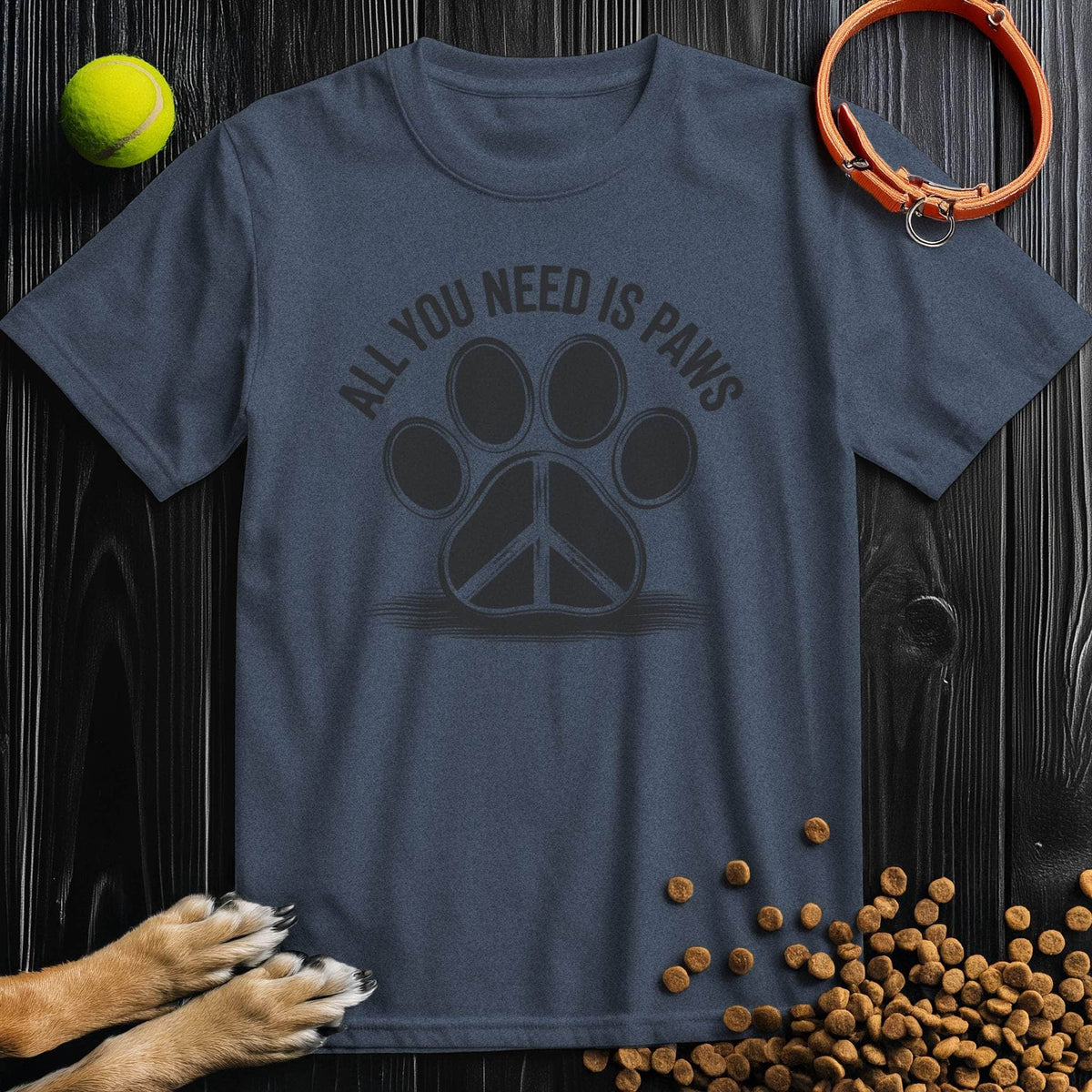 Navy blue All You Need Is Paws T-Shirt with subtle black paw and peace sign design, made from sustainable cotton. Great for pet lovers' wardrobe.