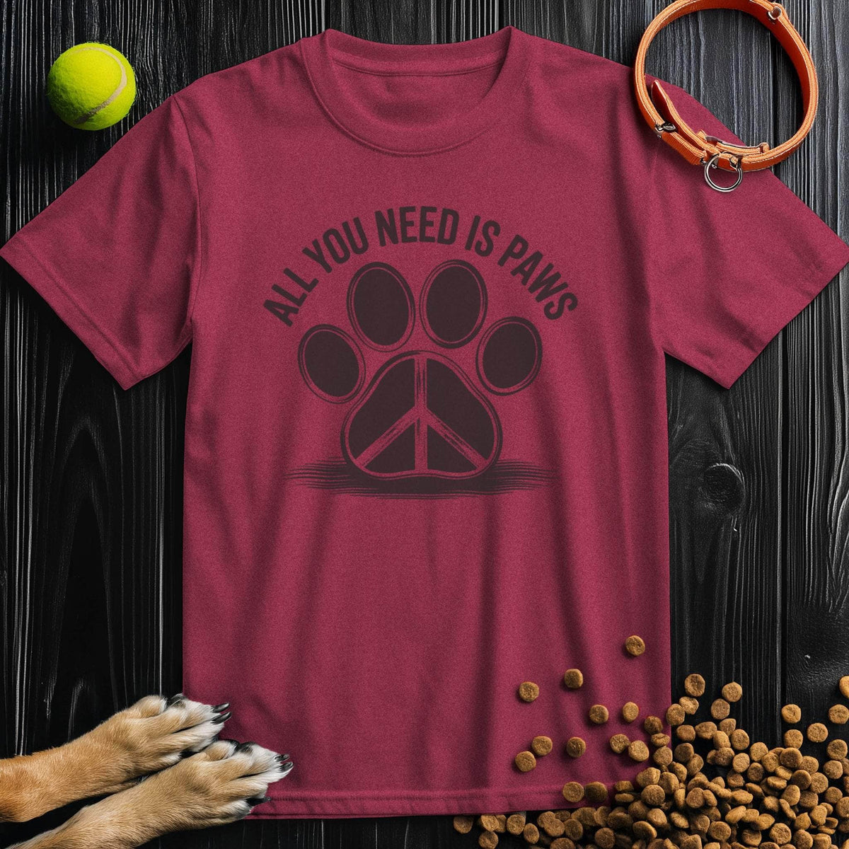 Maroon All You Need Is Paws T-Shirt featuring a black paw print with peace sign, crafted from ethical cotton. A bold and cozy dog-themed shirt.