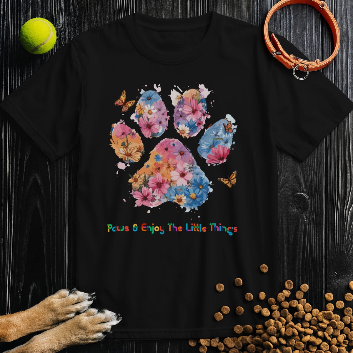 Black Paws & Enjoy Dog Watercolor Shirt showcasing multicolor floral paw print, eco-friendly cotton tee great for dog lovers and summer outfits.