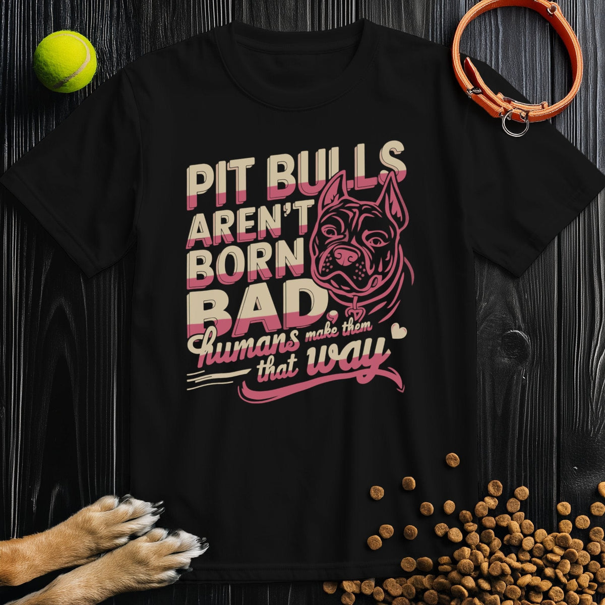 Black Pitbull T-Shirt - Not Born Bad with standout pink and beige design, unisex fit in breathable cotton for everyday comfort.