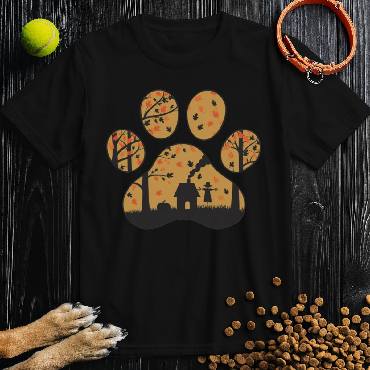 Black Paw Print Dog T-Shirt with autumn trees and a doghouse silhouette inside a paw print. Comfortable and eco-conscious dog lover apparel.