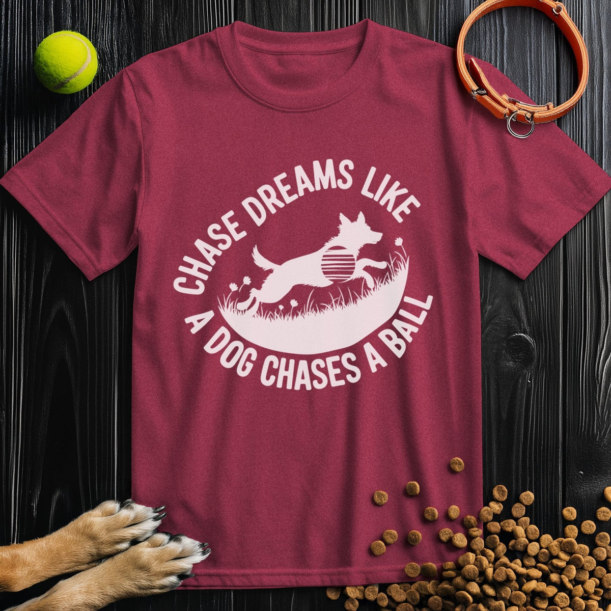 Maroon Chase Dreams T-Shirt with bold dog chasing ball design. Regular fit cotton tee great for men’s and women’s clothing.