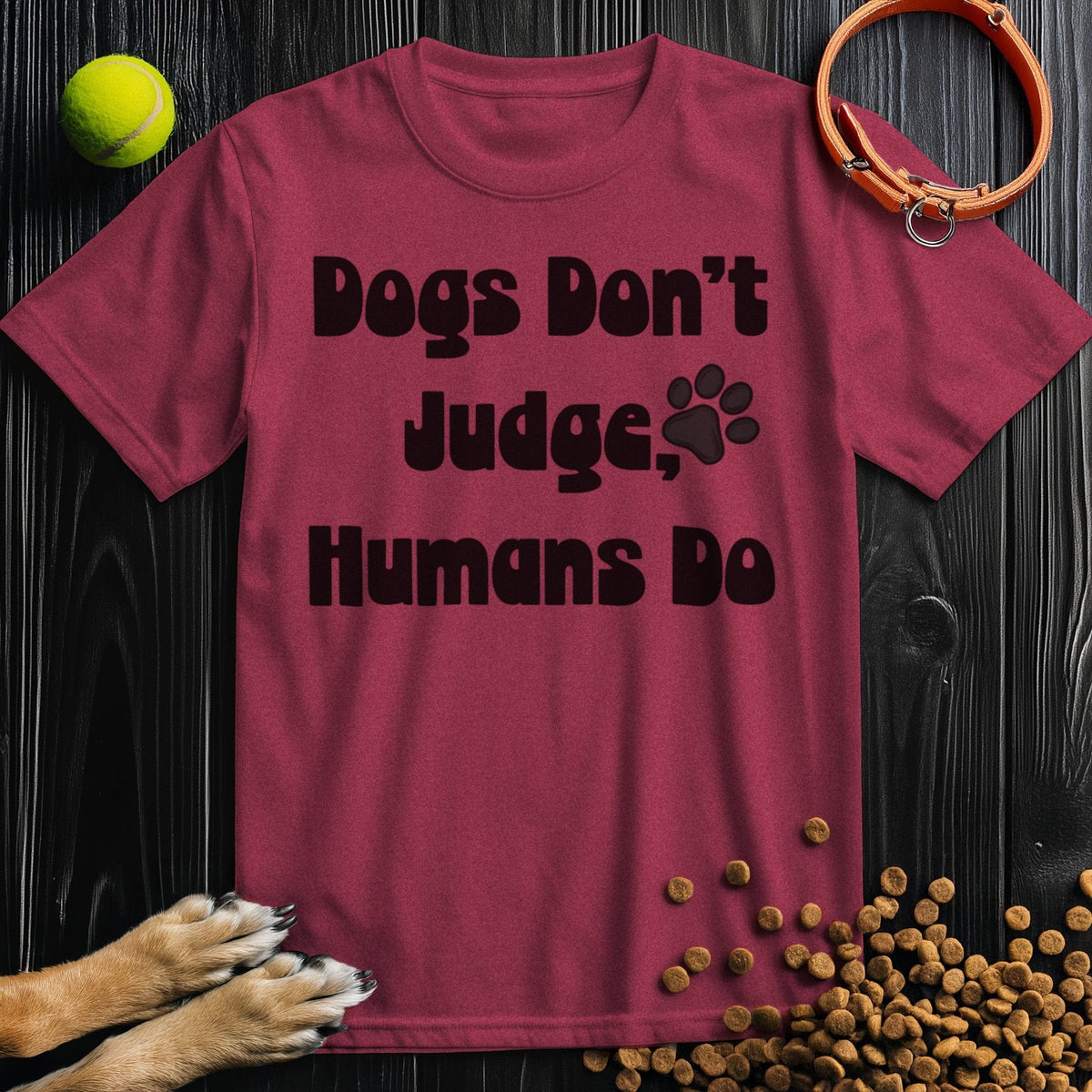 Maroon 'Dogs Don't Judge, Humans Do' cotton t-shirt with black text and paw print, a stylish pick for dog lovers and casual wear.