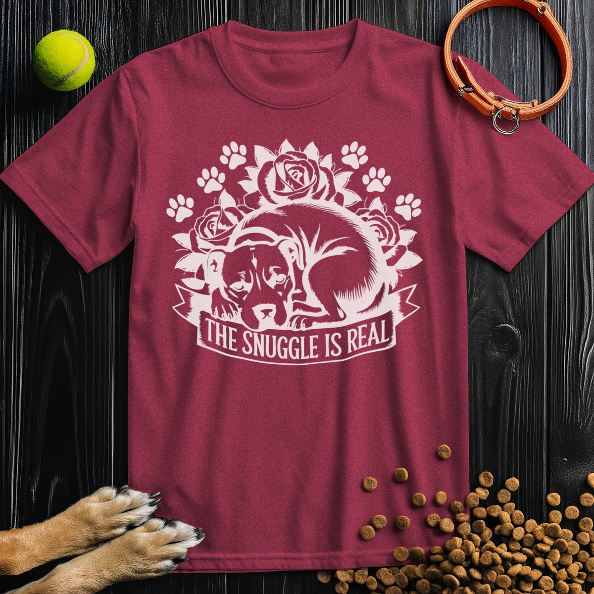 Maroon Snuggle Is Real Tee with curled dog and paw graphics, made from breathable 100% cotton, great for everyday wear.