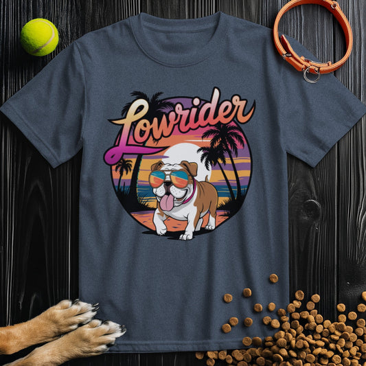 Lowrider Bulldog Sunset Tee in dark gray featuring a cartoon bulldog with sunglasses, palm trees, and sunset design. 100% cotton regular fit shirt.