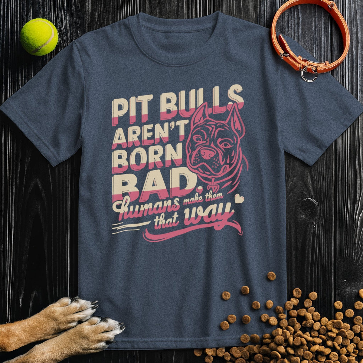 Pitbull T-Shirt - Not Born Bad in navy blue with bold pink and beige print, made from eco-friendly cotton for unisex wear.