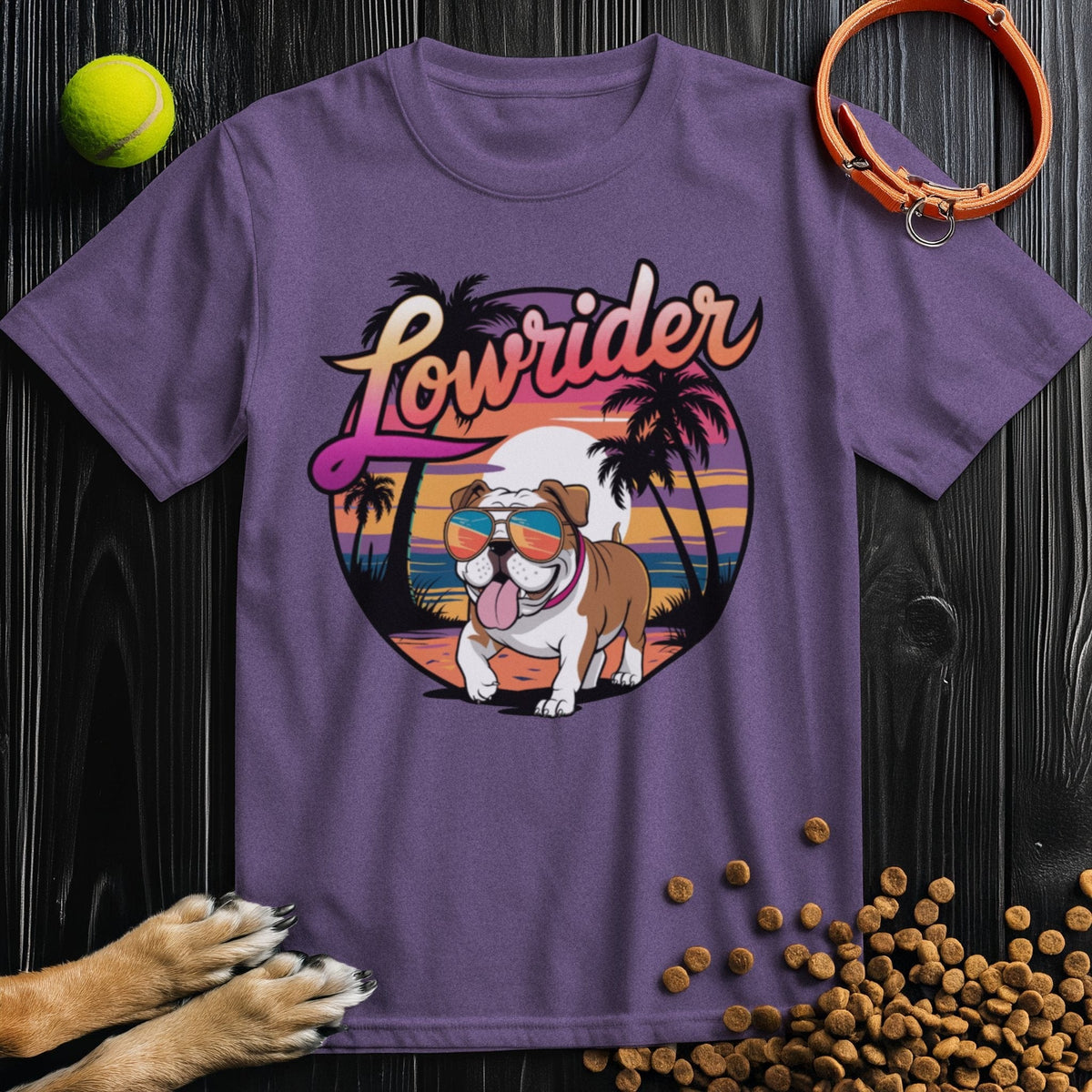 Purple Lowrider Bulldog Sunset T-Shirt showcasing a cool bulldog in shades with a tropical sunset. Soft cotton fit for men and women.