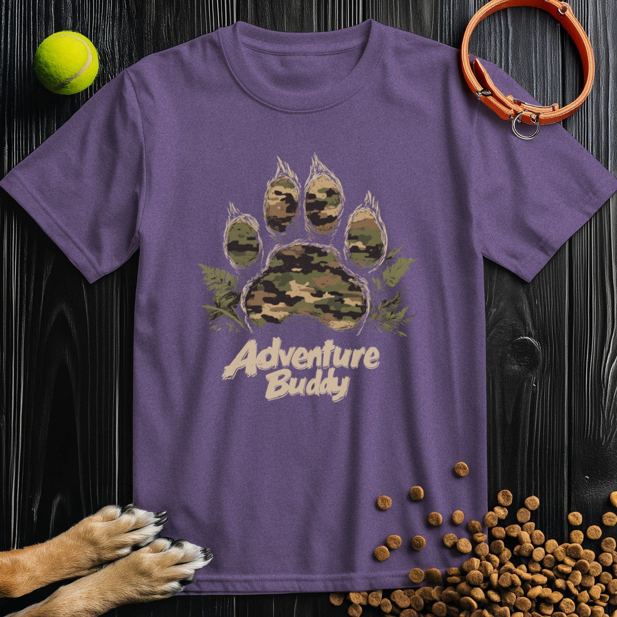 Purple Camo Paw Adventure T-Shirt with camo paw graphic and 'Adventure Buddy' lettering, comfortable cotton crew neck for dog fans.