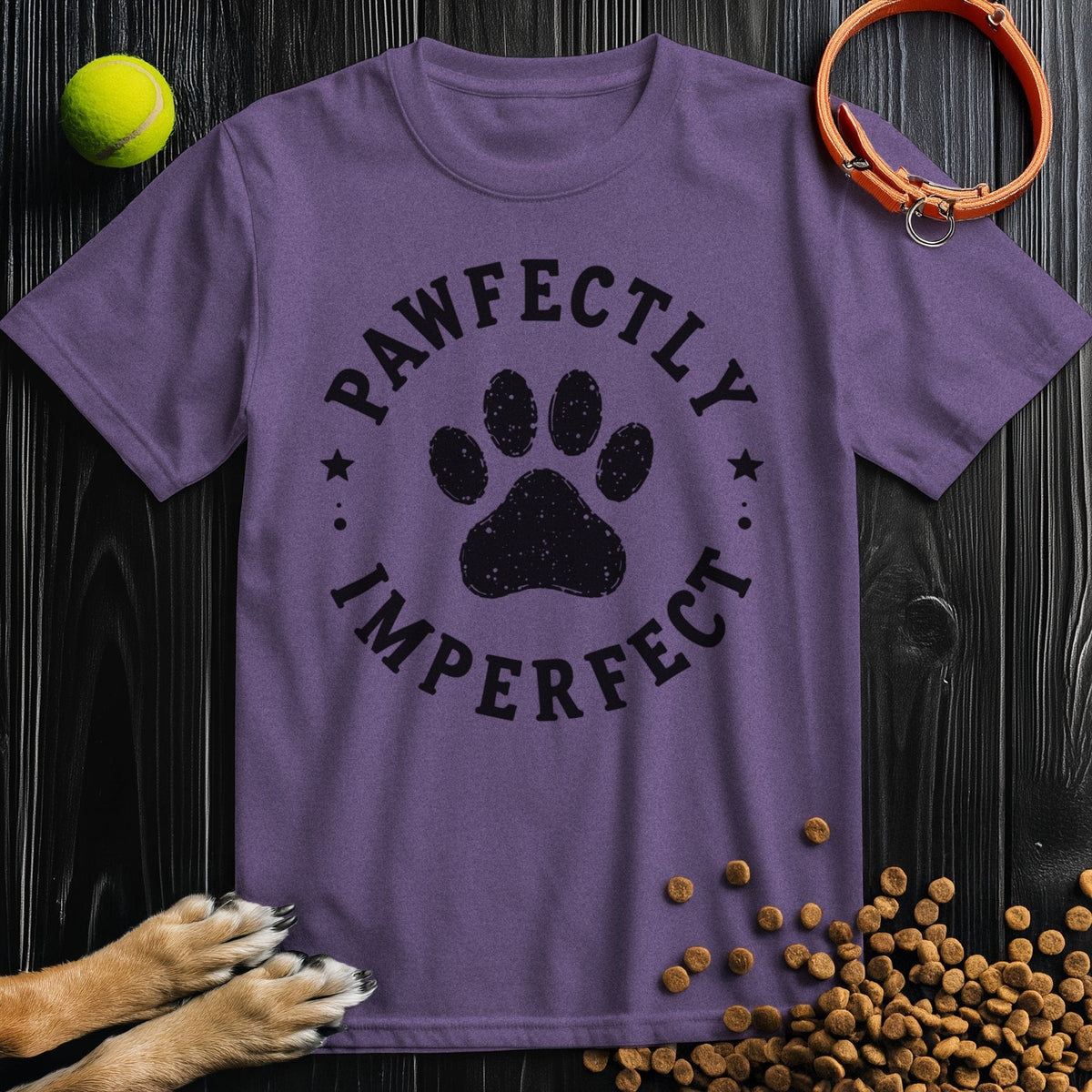 Purple dog theme shirt featuring 'Pawfectly Imperfect' paw print badge. Ethical cotton tee for animal lovers and casual fashion.