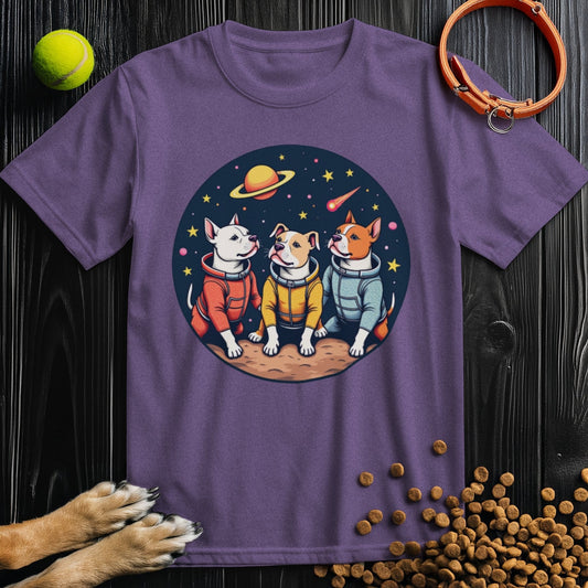 Purple Cosmic Pits T-Shirt for dog lovers featuring three cartoon dogs in astronaut suits on a planet with stars and a ringed planet in the background.