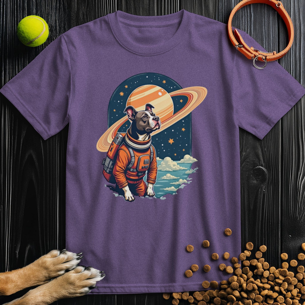 Purple Cosmic Canine T-Shirt with a vibrant dog astronaut print. A fun and cozy cotton tee for dog lovers and space fans alike.
