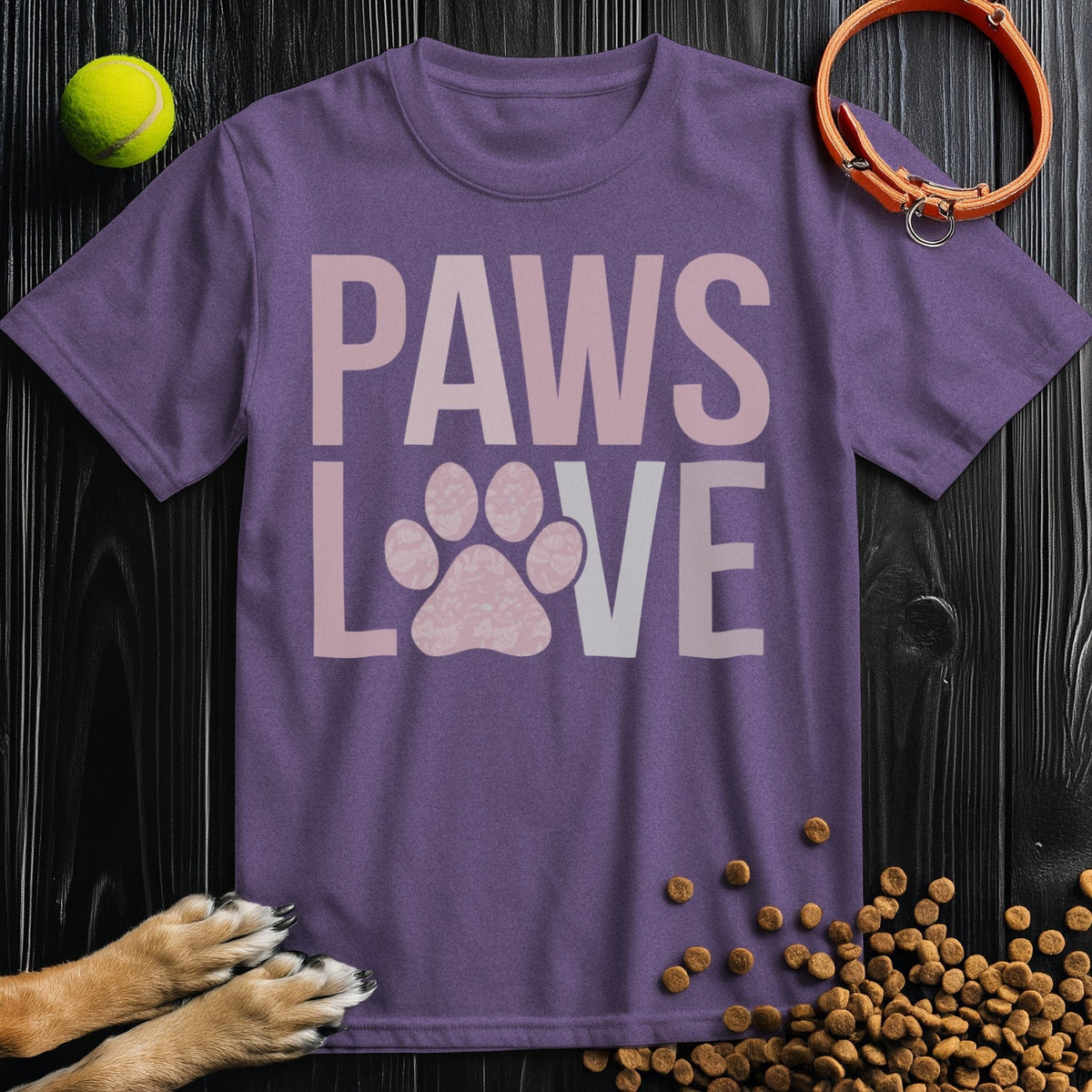 Purple Paws Love T-Shirt with dog paw graphic in pink text. Cotton crew neck tee for dog lovers, eco-friendly and ethically made.