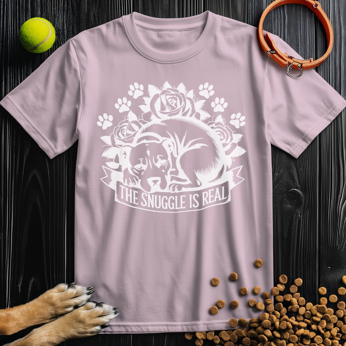 Light pink Snuggle Is Real dog-themed shirt with floral design, crafted from soft 100% cotton, ideal for pet lovers' wardrobes.