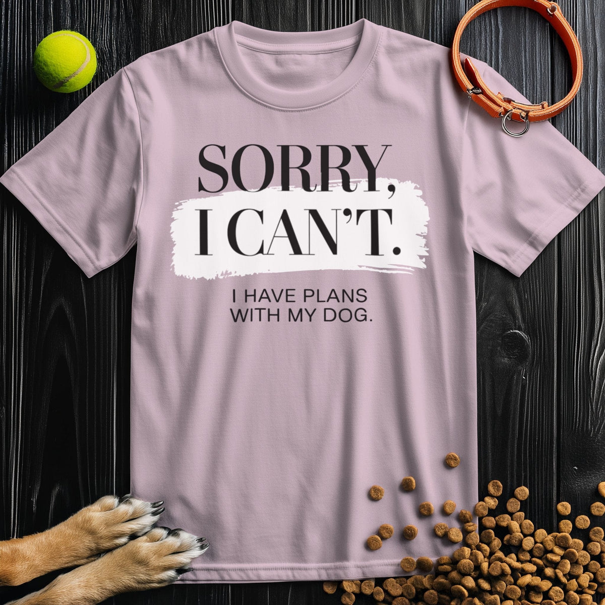 Light pink Dog Lover Edition T-Shirt with 'Sorry, I Can't' dog quote, soft cotton fabric, ideal for dog moms and casual pet lovers.