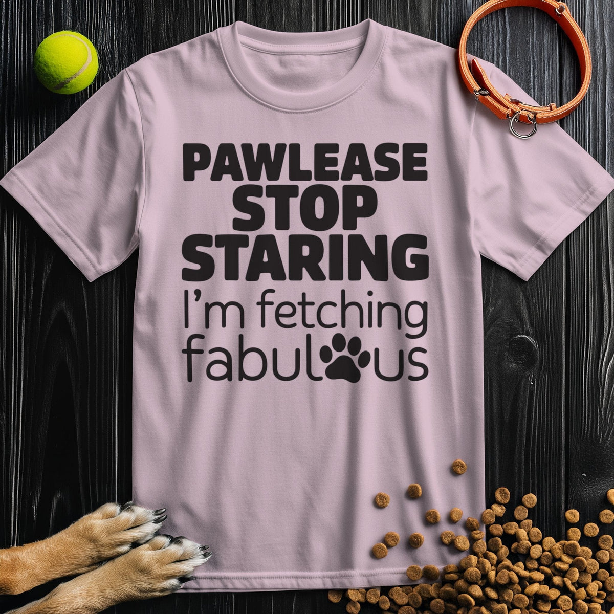 Light pink Fetching Fabulous T-Shirt with black dog pun design. Unisex cotton shirt combining comfort and playful pet-themed style.