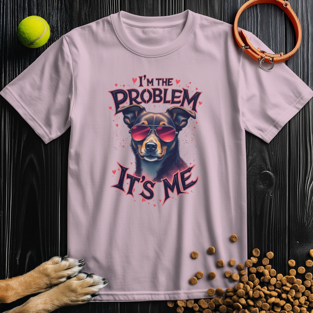 The Problematic Pooch T-Shirt in light pink features a cool dog with sunglasses and 'I'm the Problem It's Me' text, made from 100% cotton.