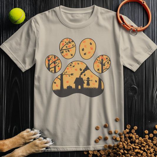 Beige Harvest Woods Paw Print Dog T-Shirt featuring a fall-themed paw print design with trees and a doghouse. Ethically made from 100% US cotton.