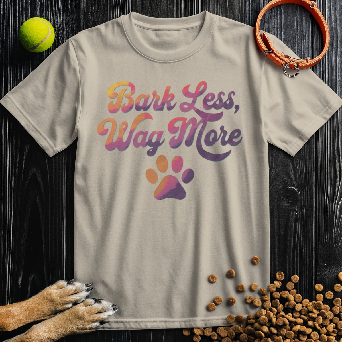 Dog Lover Shirt - Bark Less, Wag More in beige, unisex crew neck T-shirt made from US-grown cotton, featuring paw print and playful text.