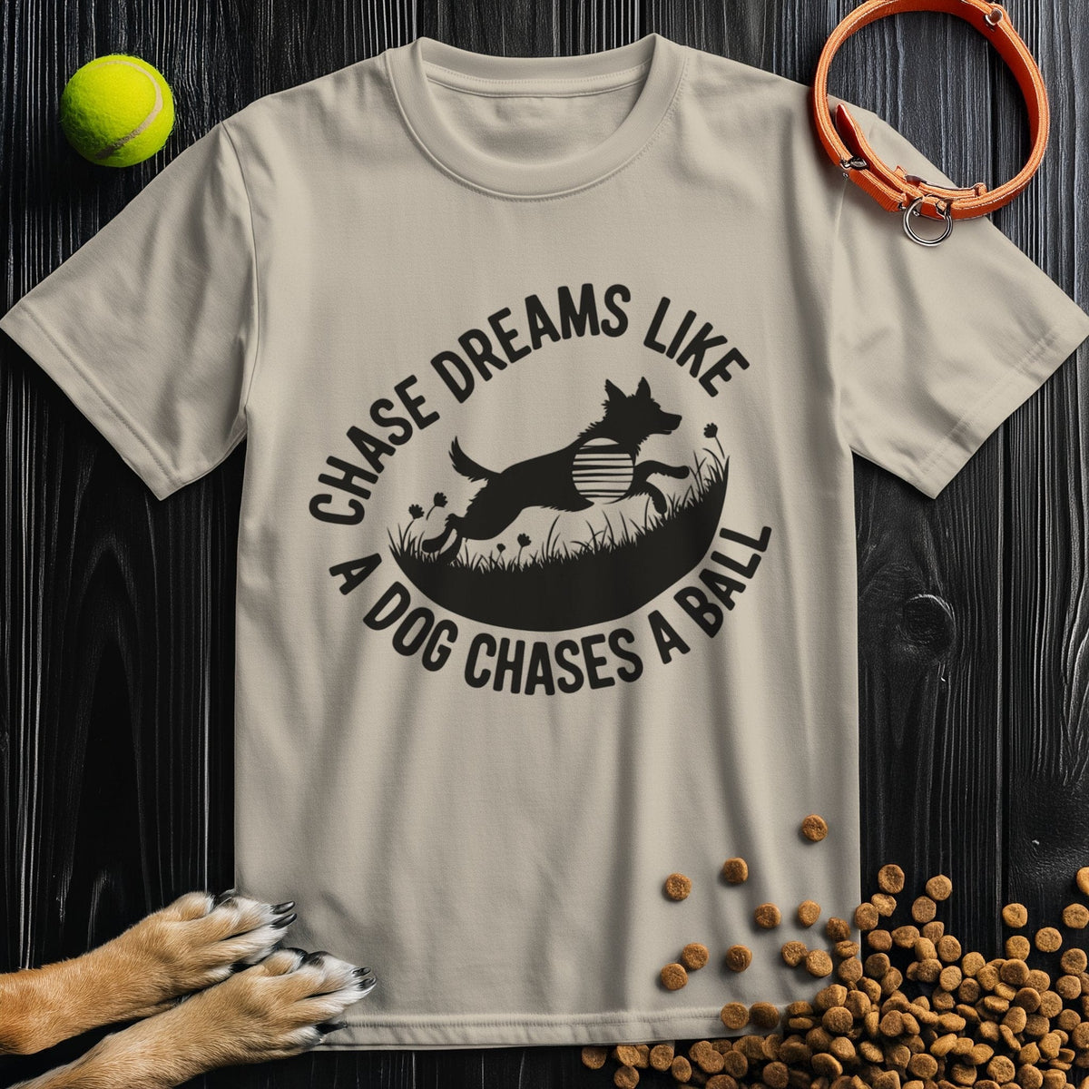 Beige Chase Dreams T-Shirt with dog chasing ball artwork. Ethically made cotton tee with a regular fit for versatile styling.