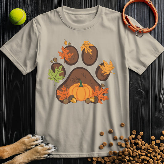 Beige Dog T-Shirt for Humans from Harvest Paw Prints Collection featuring a fall-themed paw print with leaves and pumpkin, made of 100% cotton.