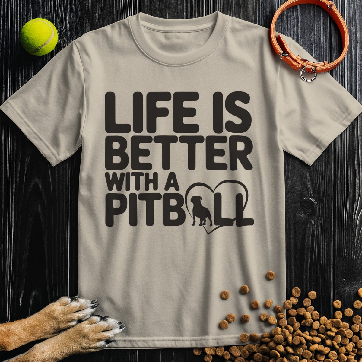 Beige Pitbull T-Shirt with bold black 'Life Is Better With A Pitbull' text and heart silhouette. Made from 100% ring-spun cotton for comfort.