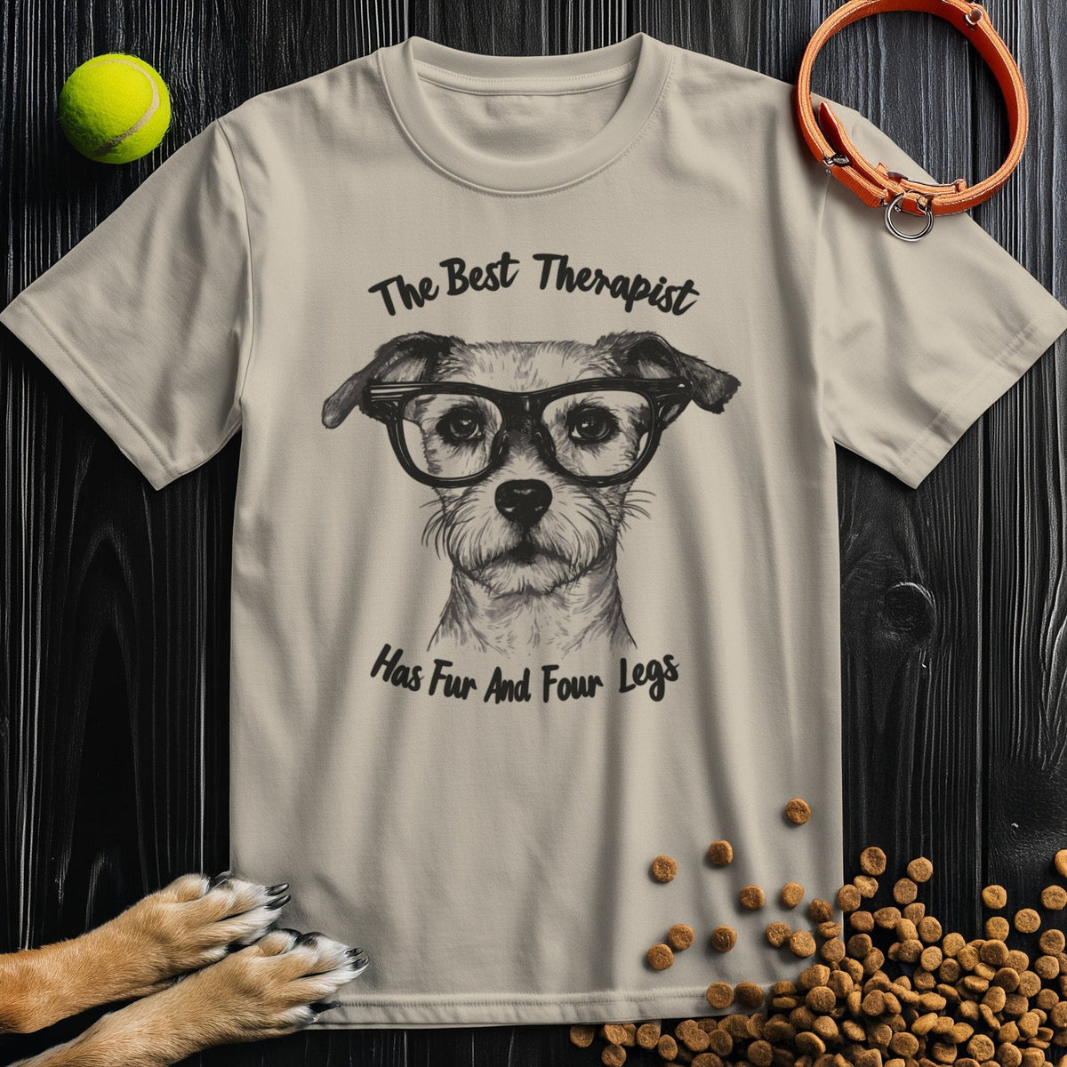 Beige 'The Best Therapist Has Fur And Four Legs' T-shirt featuring a dog with glasses. Made from ring-spun cotton, ideal for pet lovers.