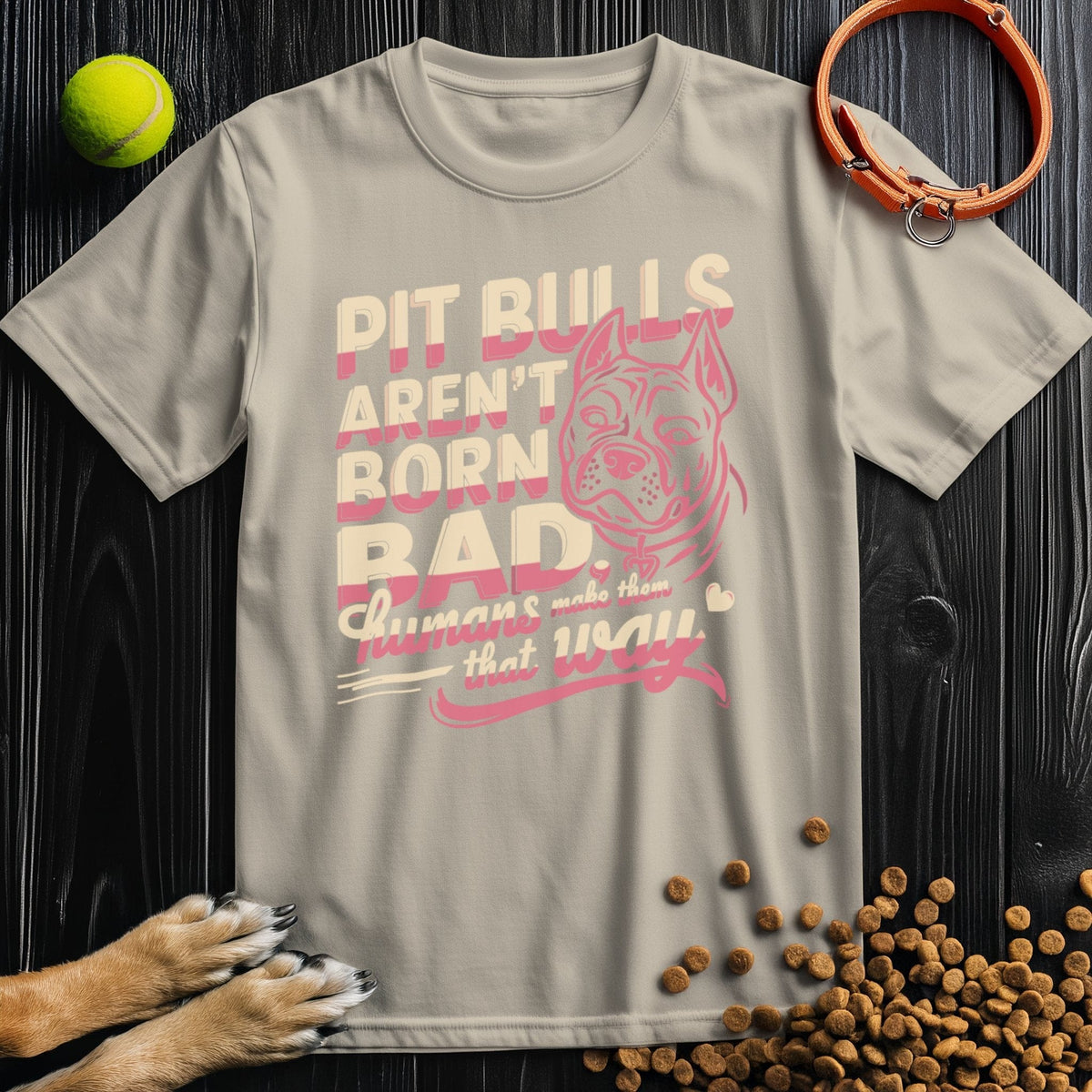 Beige Not Born Bad Pitbull T-Shirt with soft pink and cream print, made from 100% ring-spun cotton for ethical comfort.