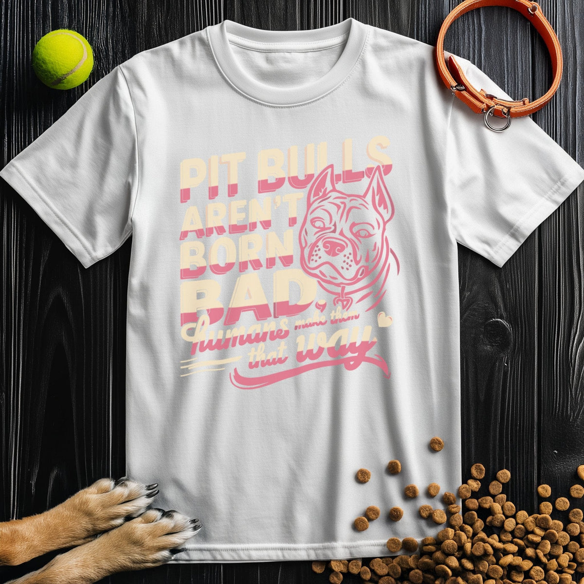 White Not Born Bad Pitbull T-Shirt featuring a pink pitbull graphic and quote, crafted from soft, sustainable cotton.