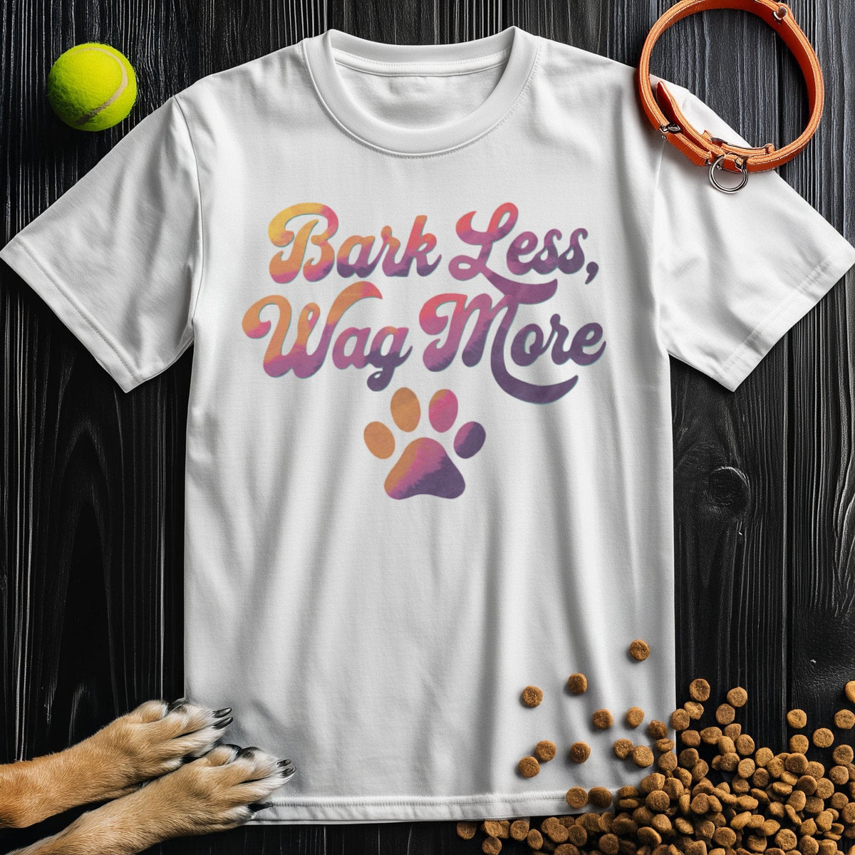 Dog Lover Shirt - Bark Less, Wag More in white, soft cotton unisex T-shirt with multicolor script and paw print, great for pet lovers.
