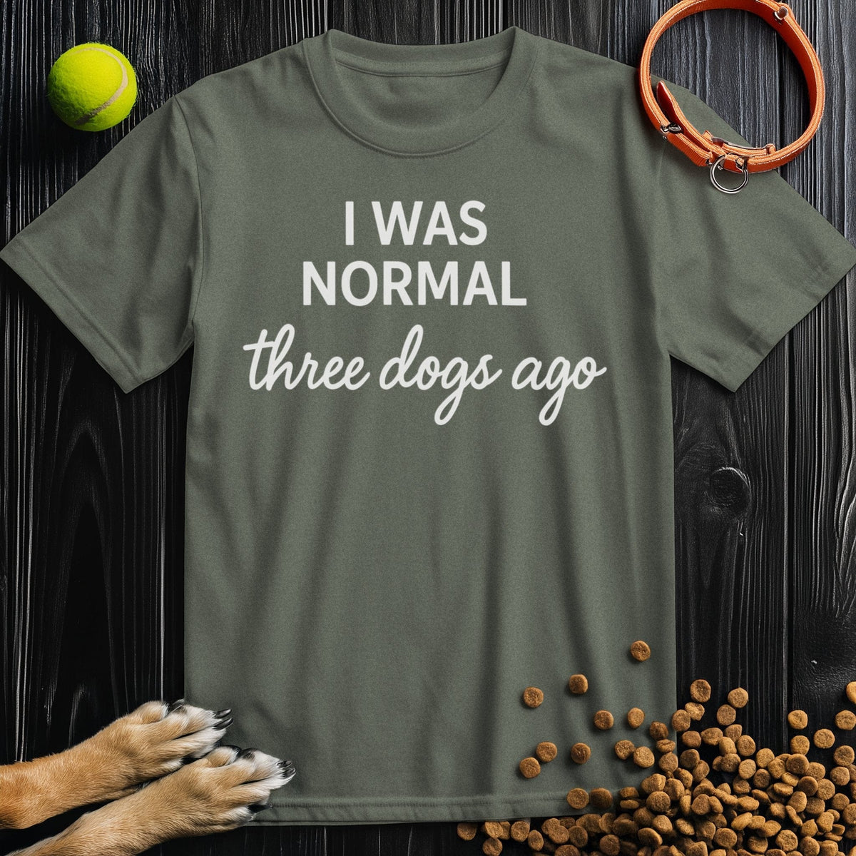 Front view of ‘I Was Normal 3 Dogs Ago’ dog tee in heather military green