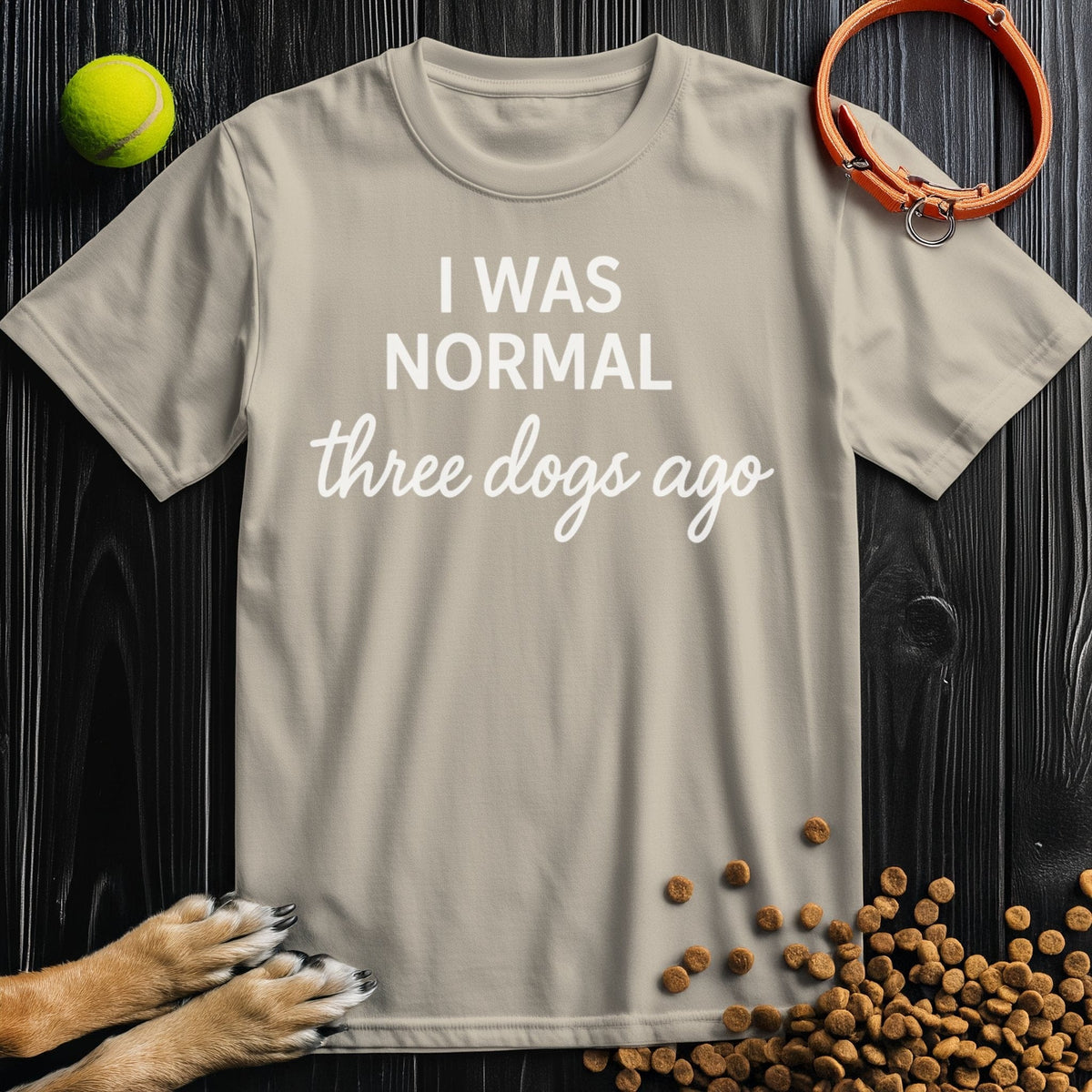 Front view of ‘I Was Normal 3 Dogs Ago’ dog tee in sand